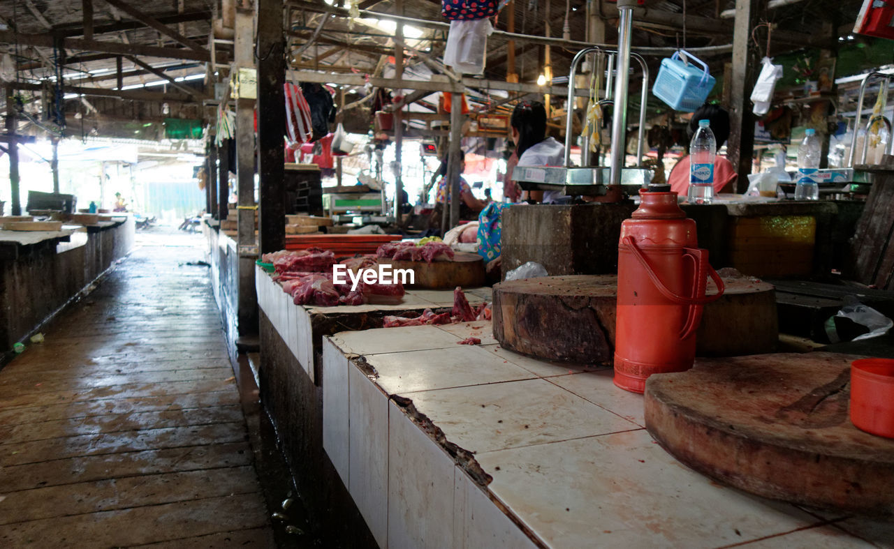 people in market stall