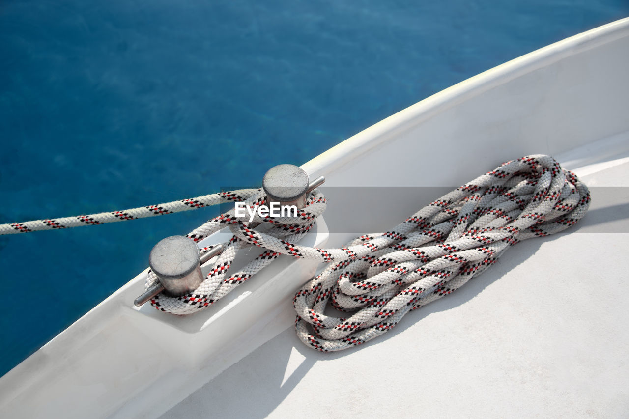 High angle view of rope tied yacht cleat