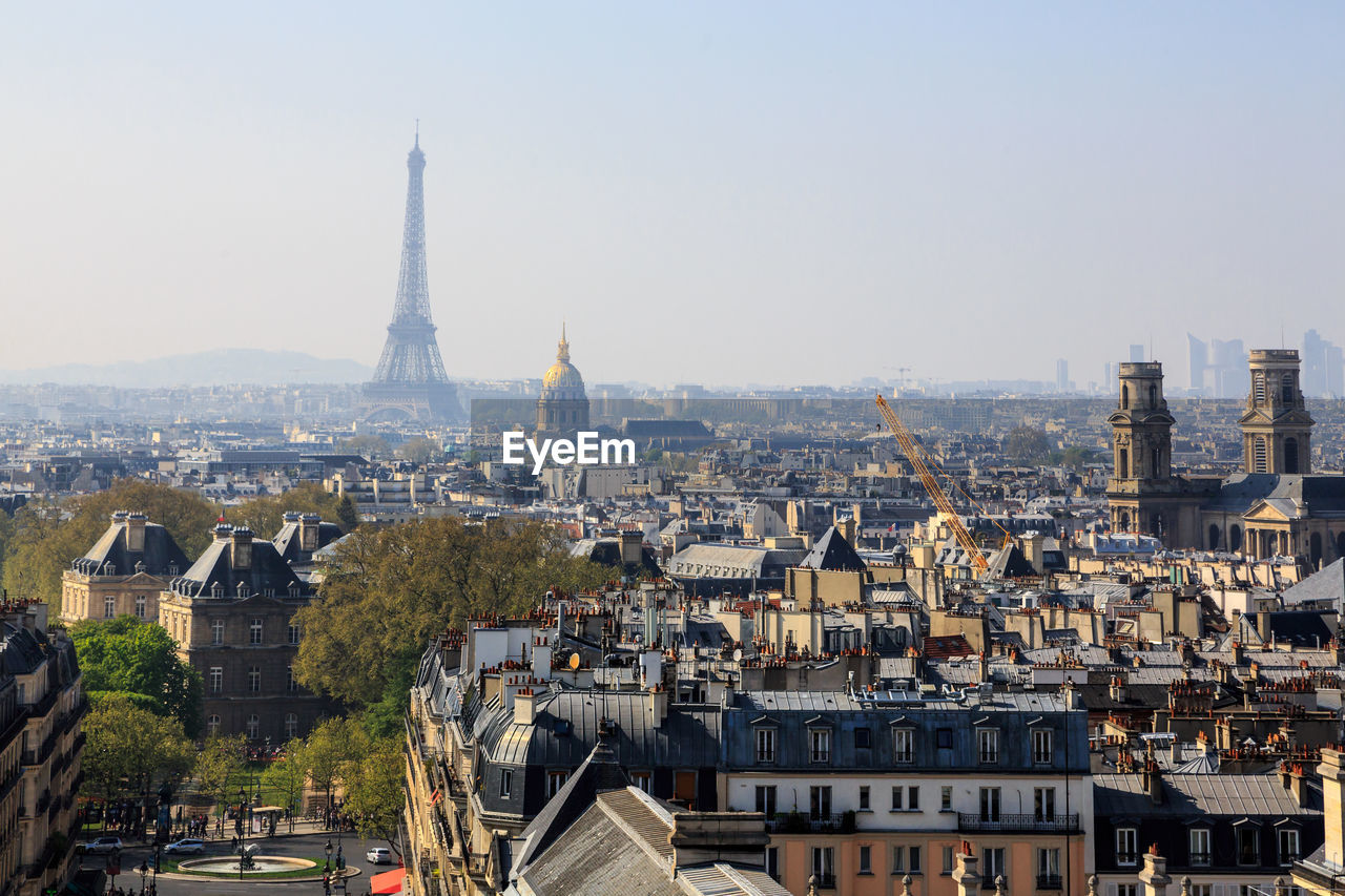 Aerial view of buildings in paris against clear sky