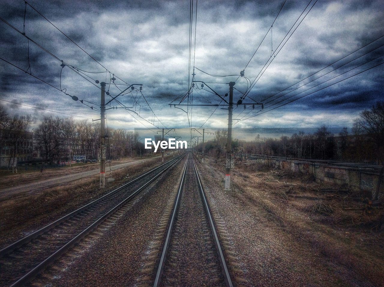 High angle view of railroad tracks against cloudy sky