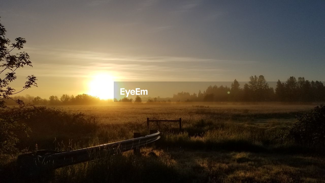 Scenic view of landscape against sky during sunset