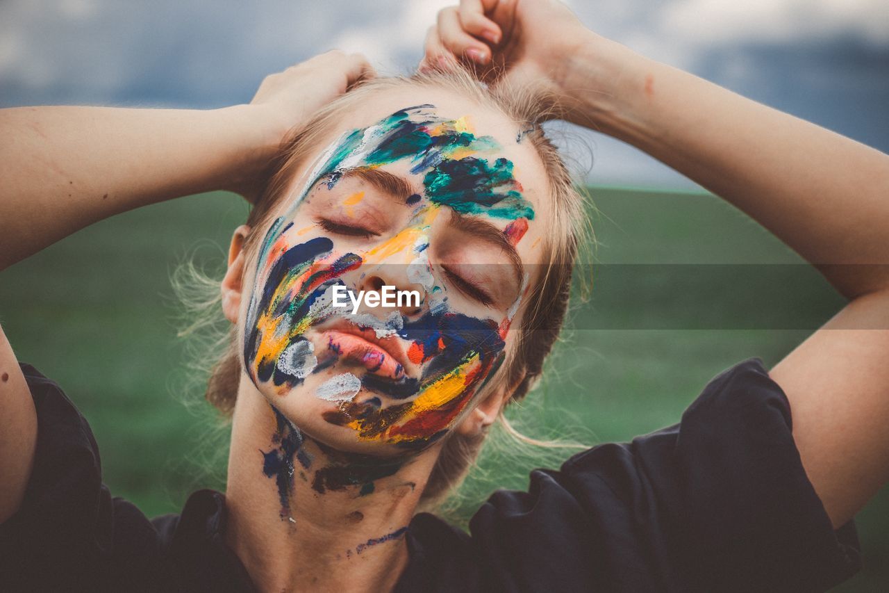 Close-up of young woman with face paint