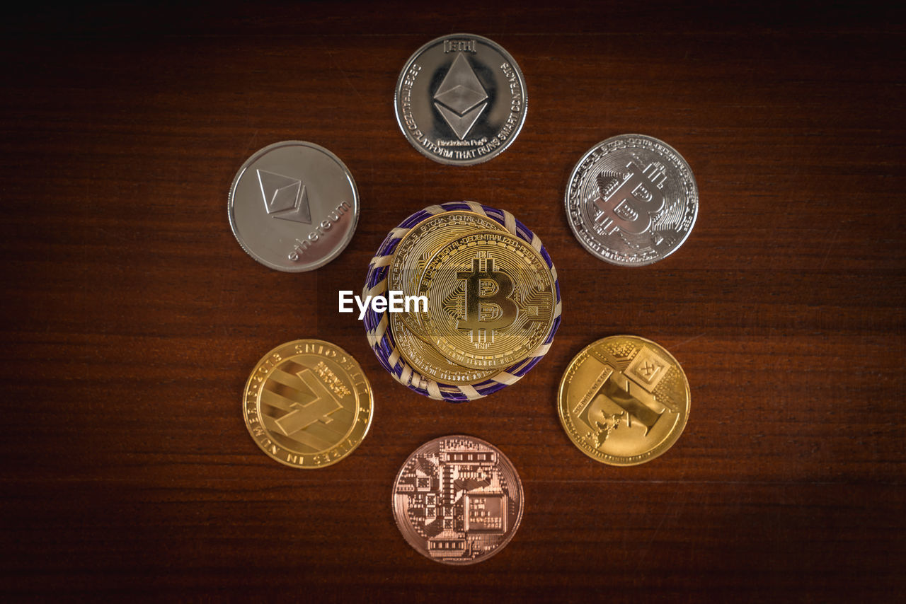 Close-up of bitcoins on wooden table