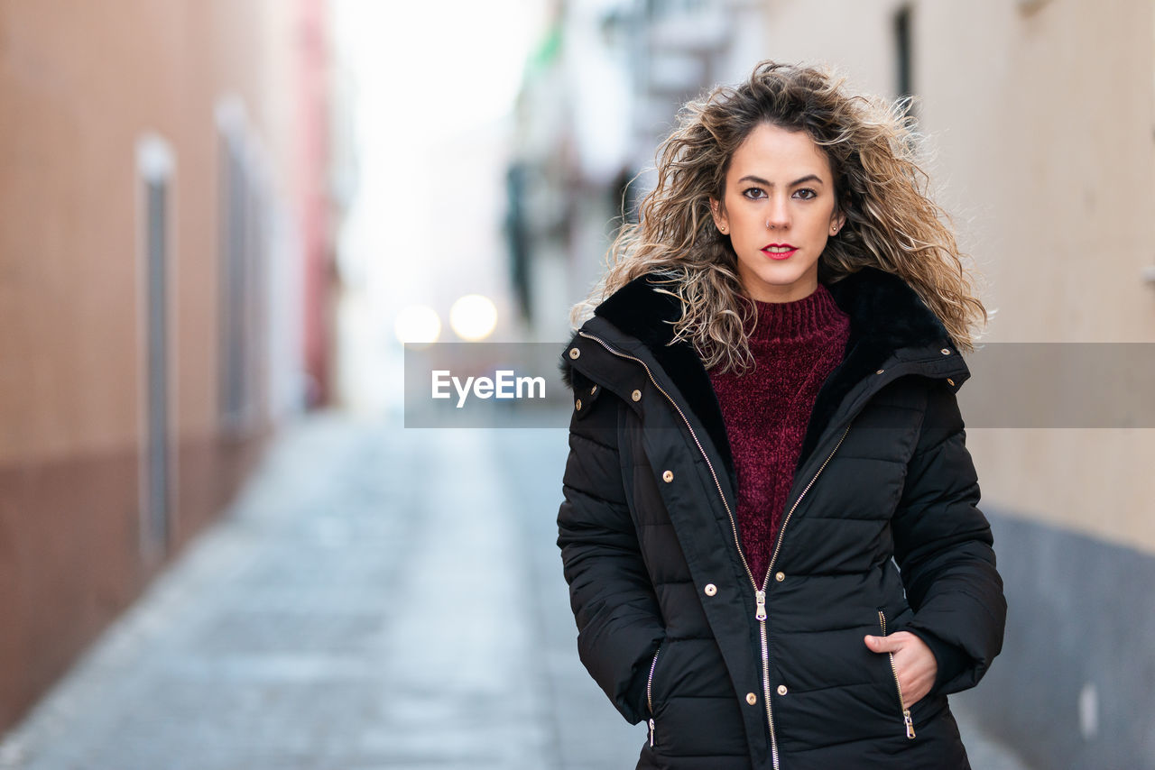 Portrait of woman standing outdoors