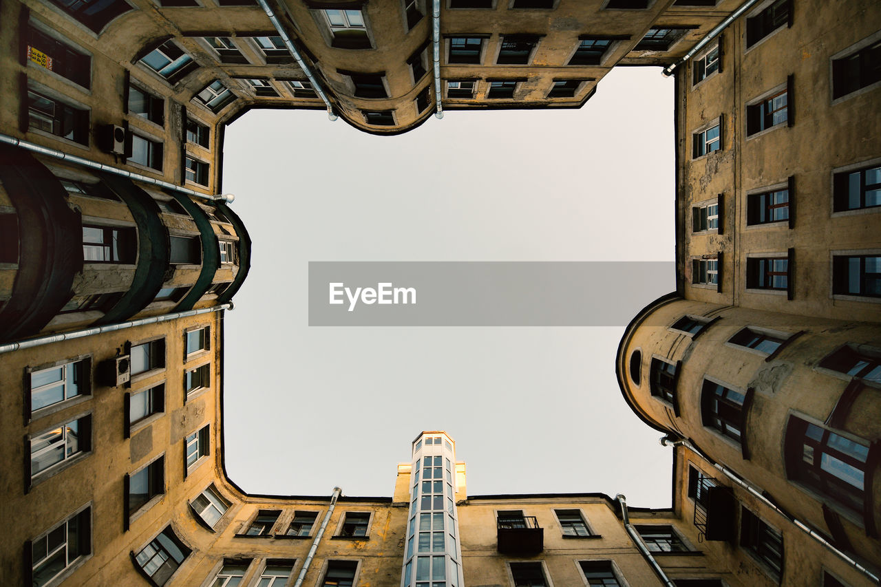 Low angle view of buildings against clear sky