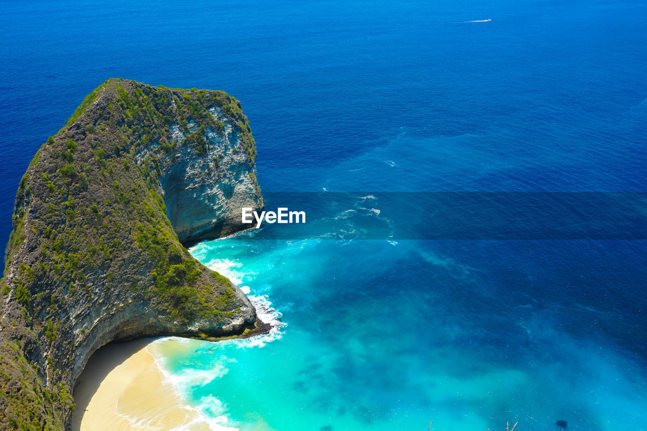 High angle view of rock in sea