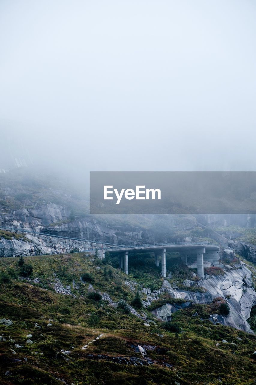 Bridge against sky during foggy weather