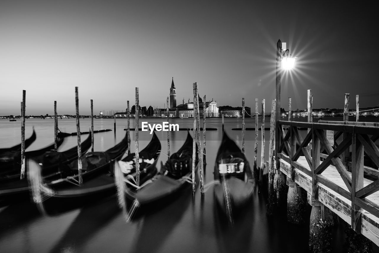 View of boats moored in canal