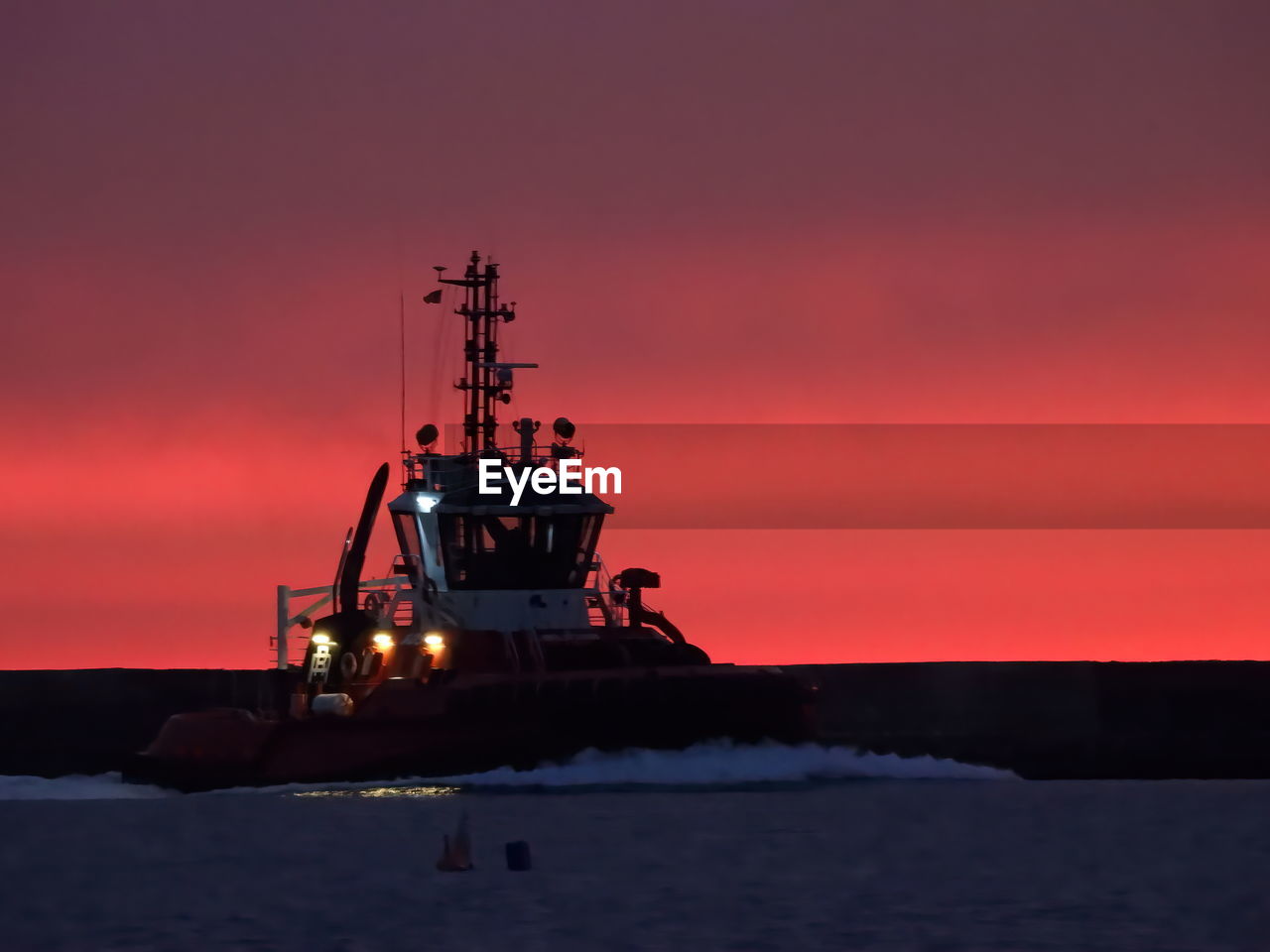 boat on sea against sky during sunset