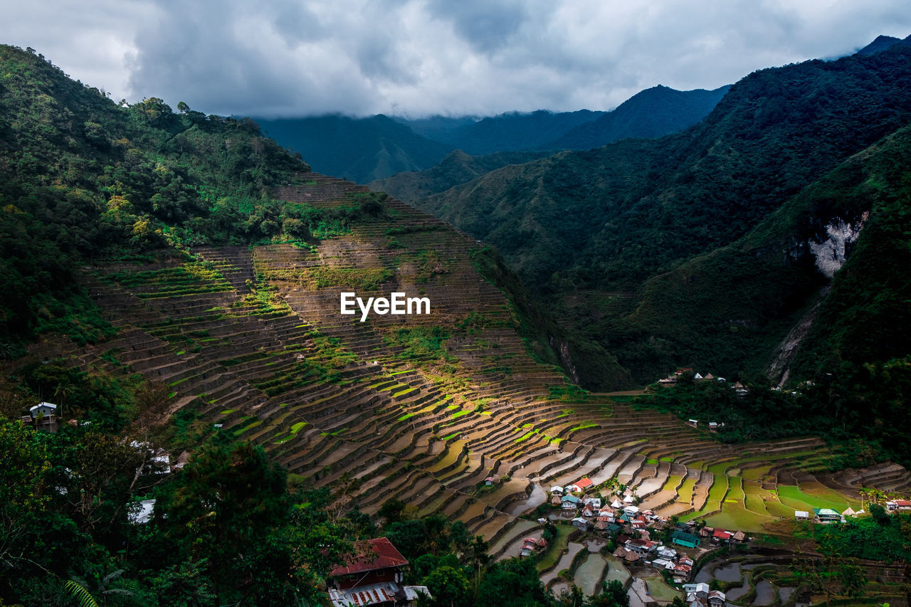 High angle view of trees and mountains against sky