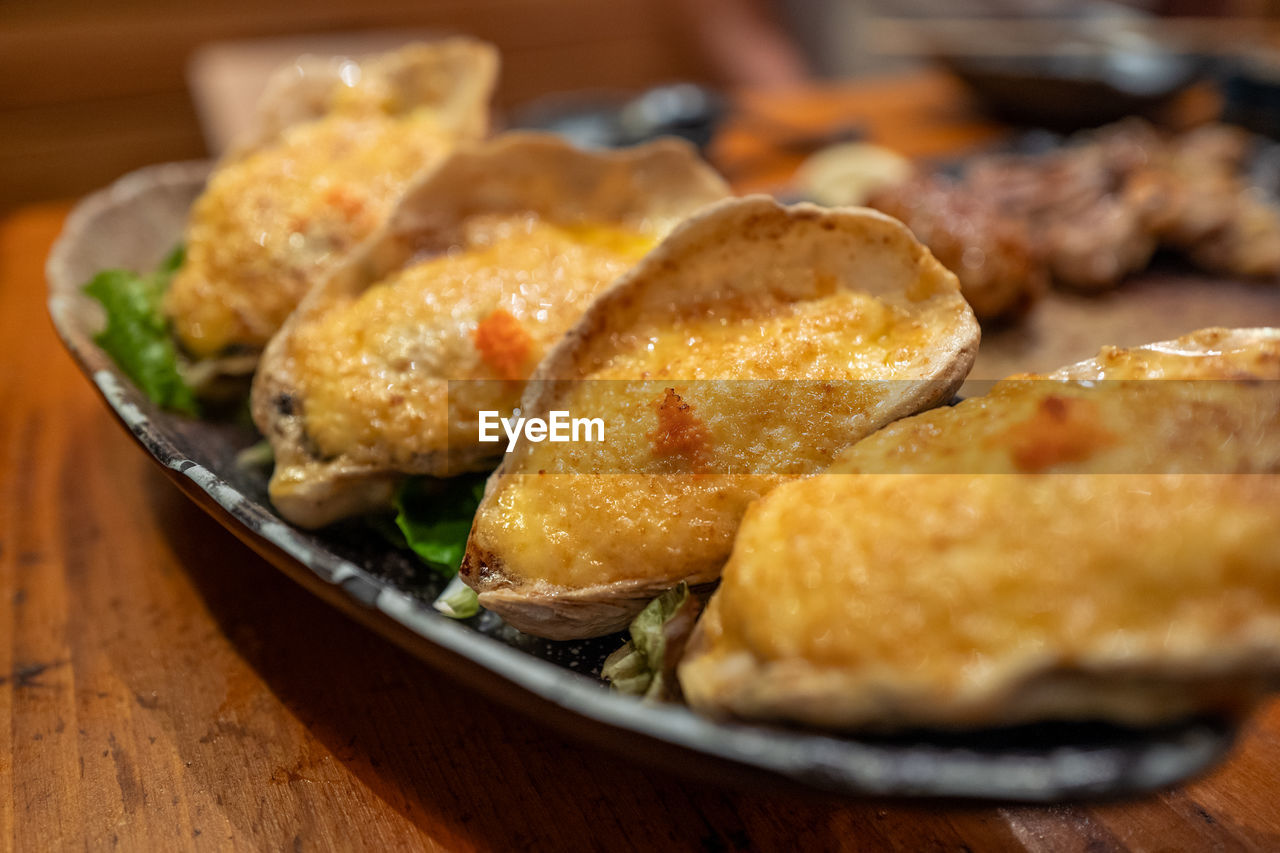 food and drink, food, freshness, fried food, dish, no people, fast food, asian food, fried, selective focus, table, healthy eating, close-up, indoors, meat, cuisine, meal, vegetable, wood, plate, still life, produce, focus on foreground, wellbeing, breakfast, snack