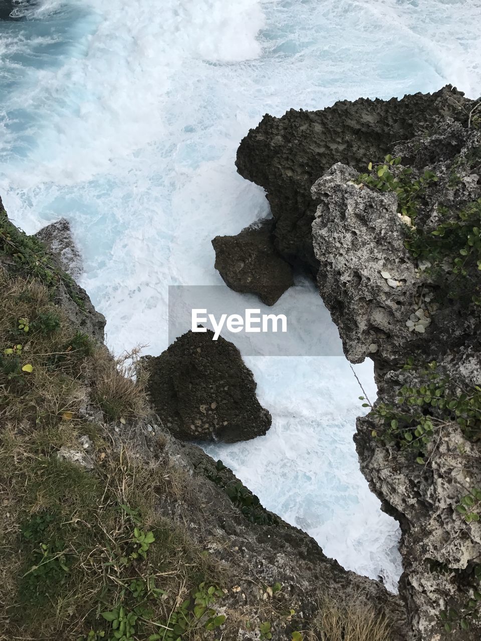 High angle view of rocks in sea