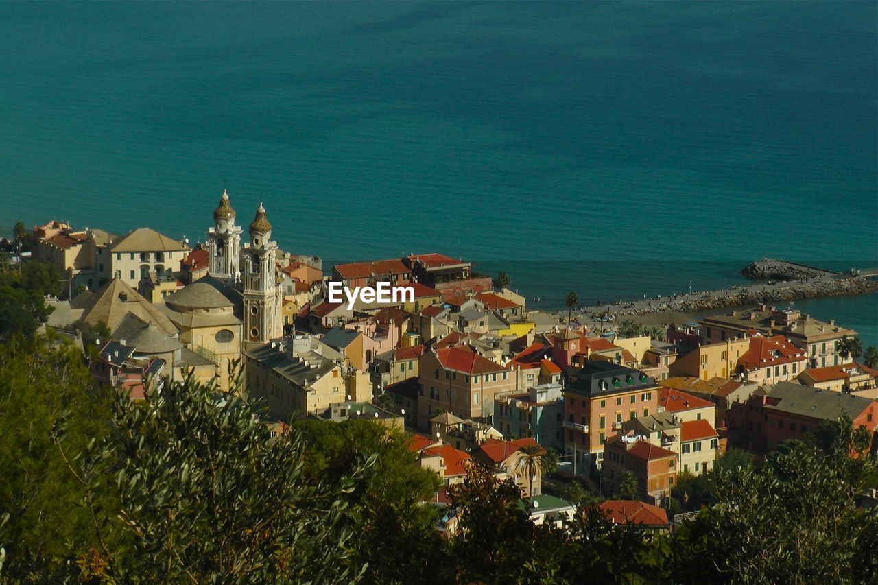 High angle view of townscape by sea