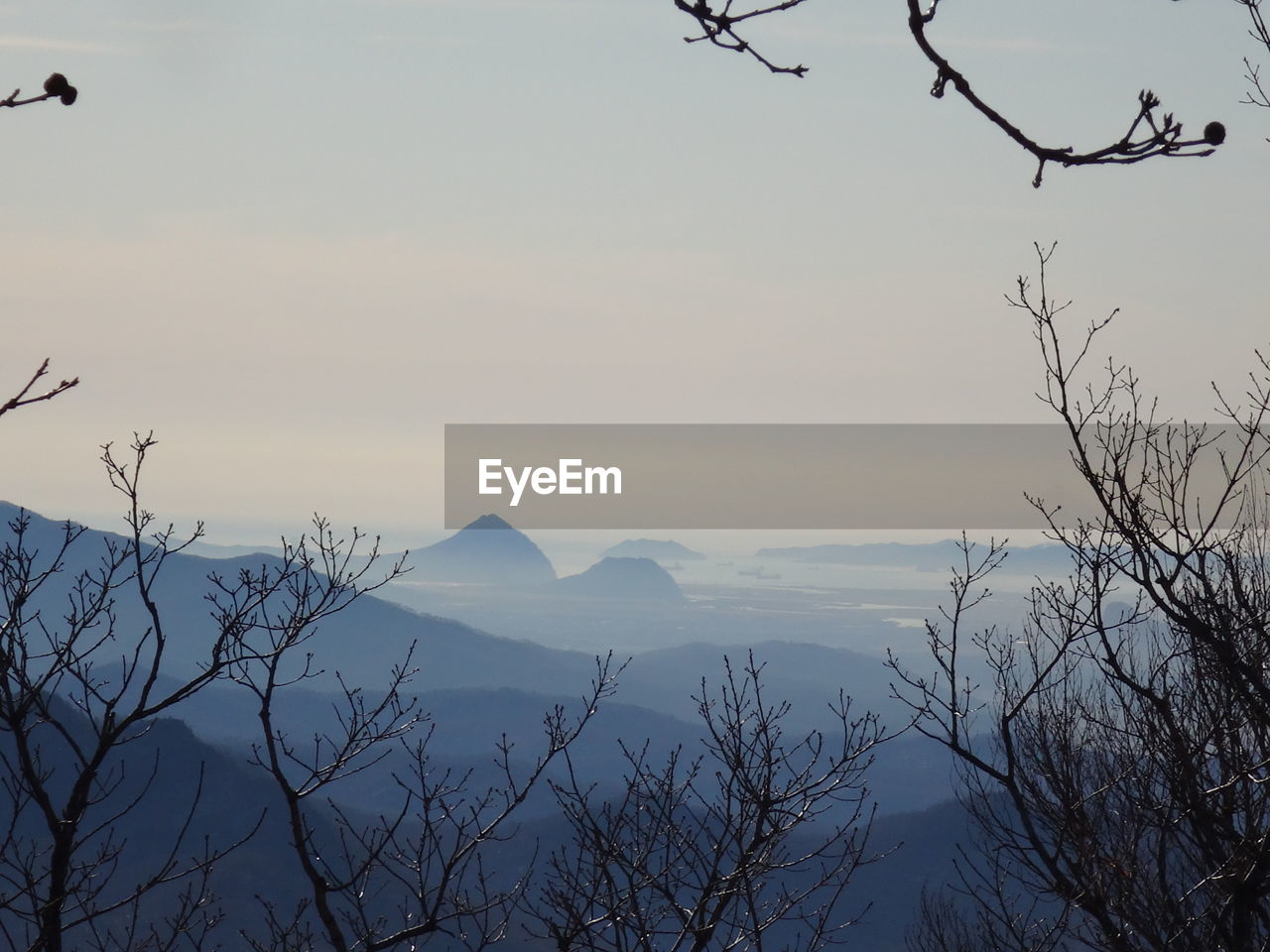 Scenic view of mountains against sky during sunset