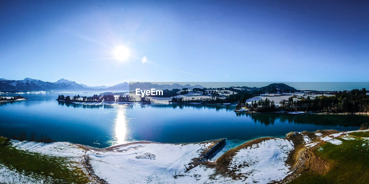 Scenic view of frozen lake against clear sky