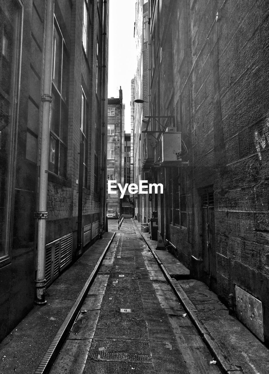 NARROW ALLEY AMIDST BUILDINGS