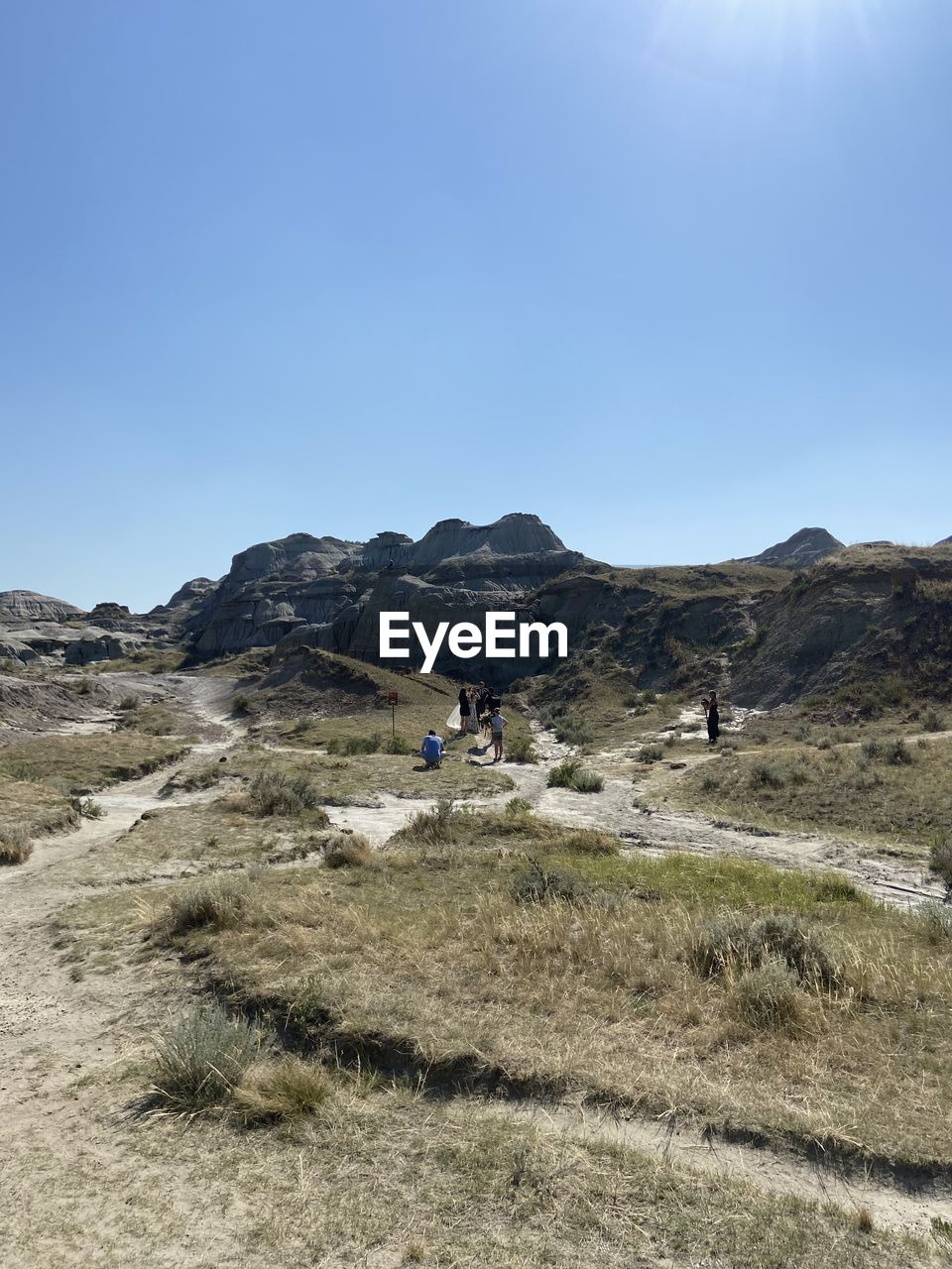 Scenic view of mountains against clear blue sky