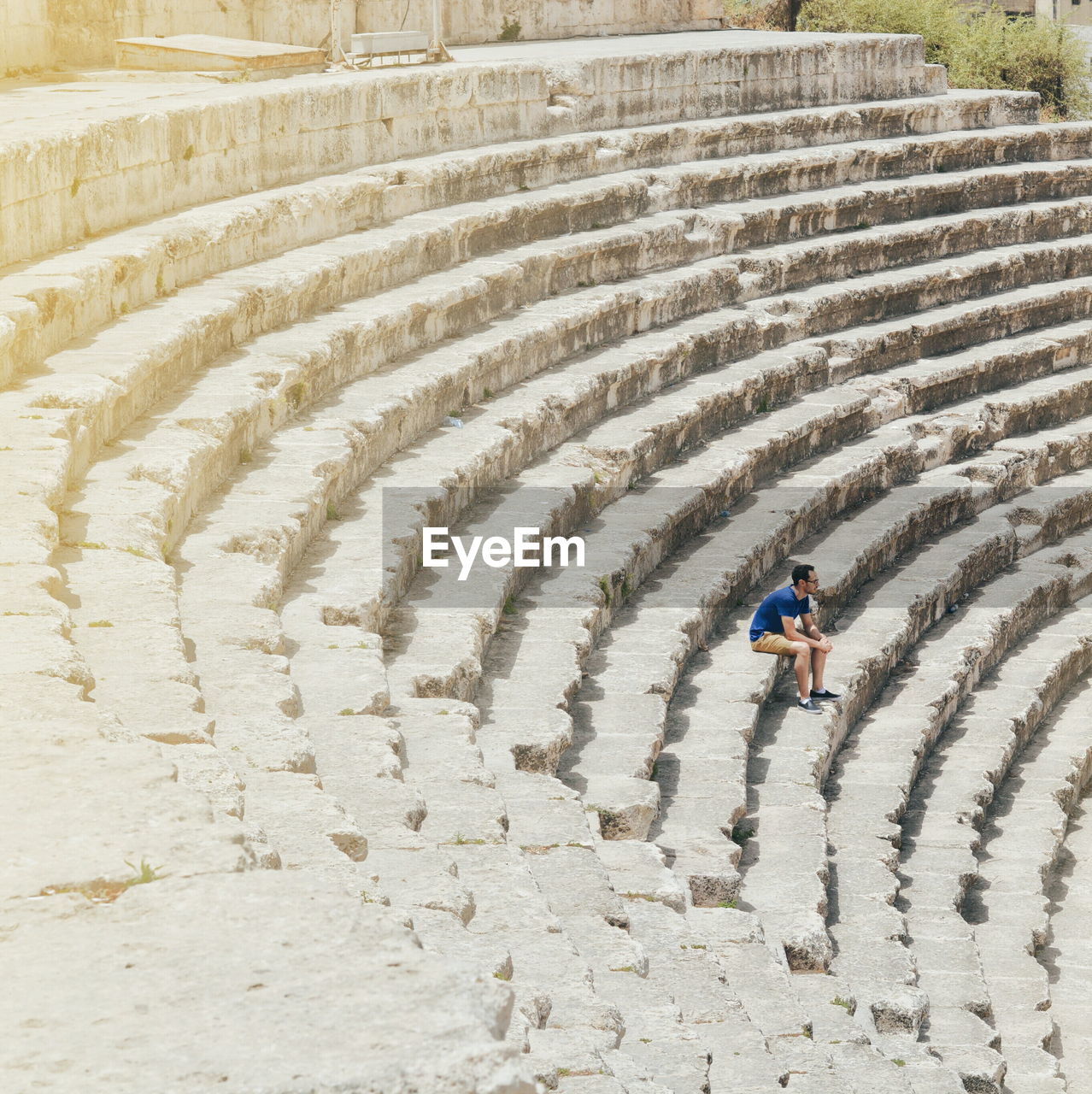 High angle view of man sitting at roman theater