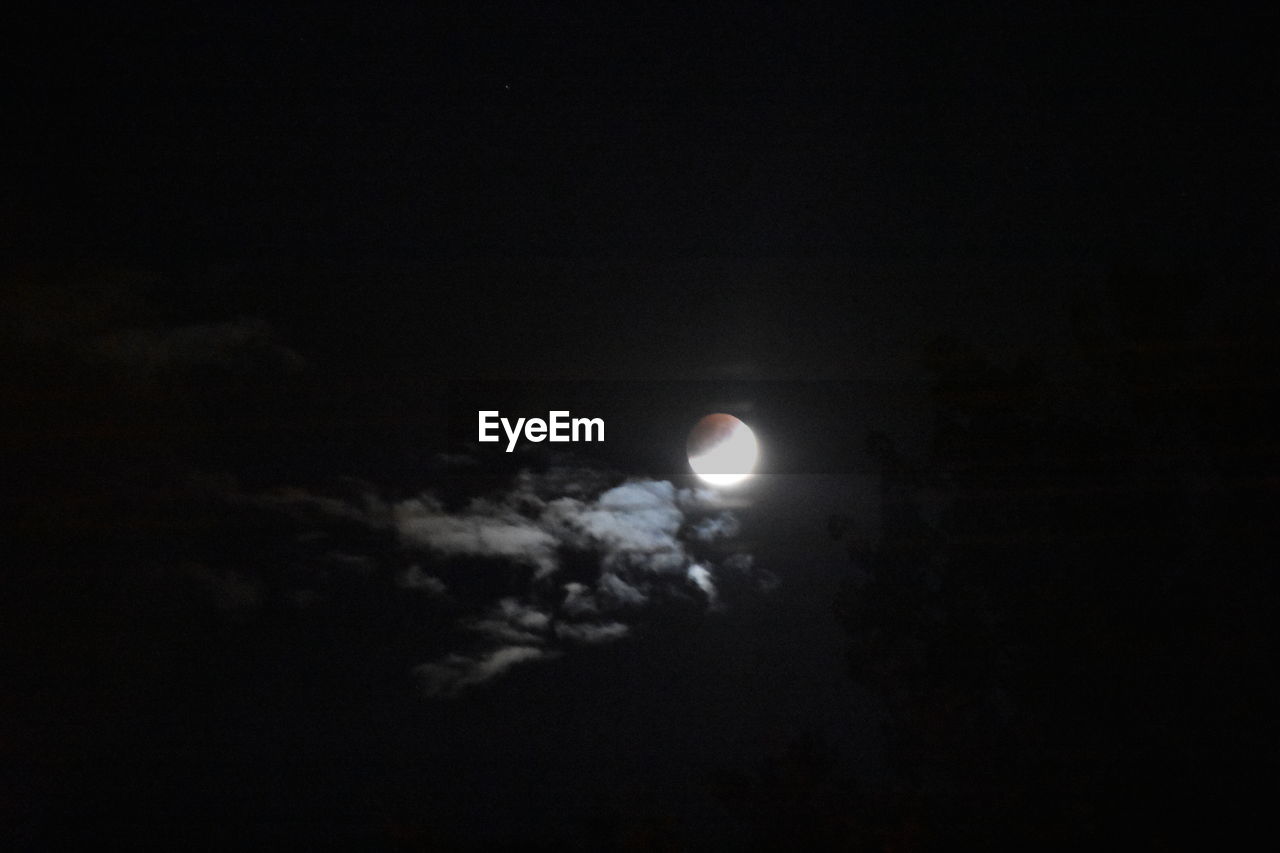 LOW ANGLE VIEW OF MOON AT NIGHT