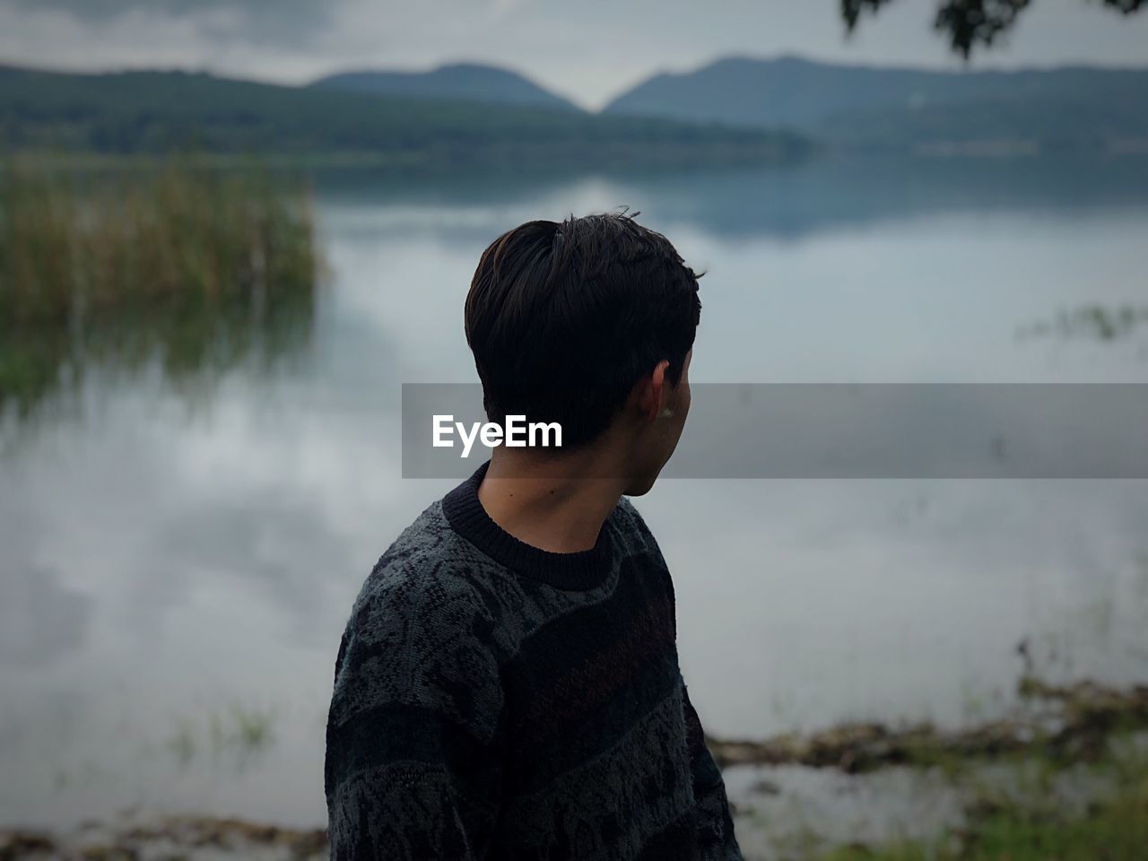 Man looking at lake