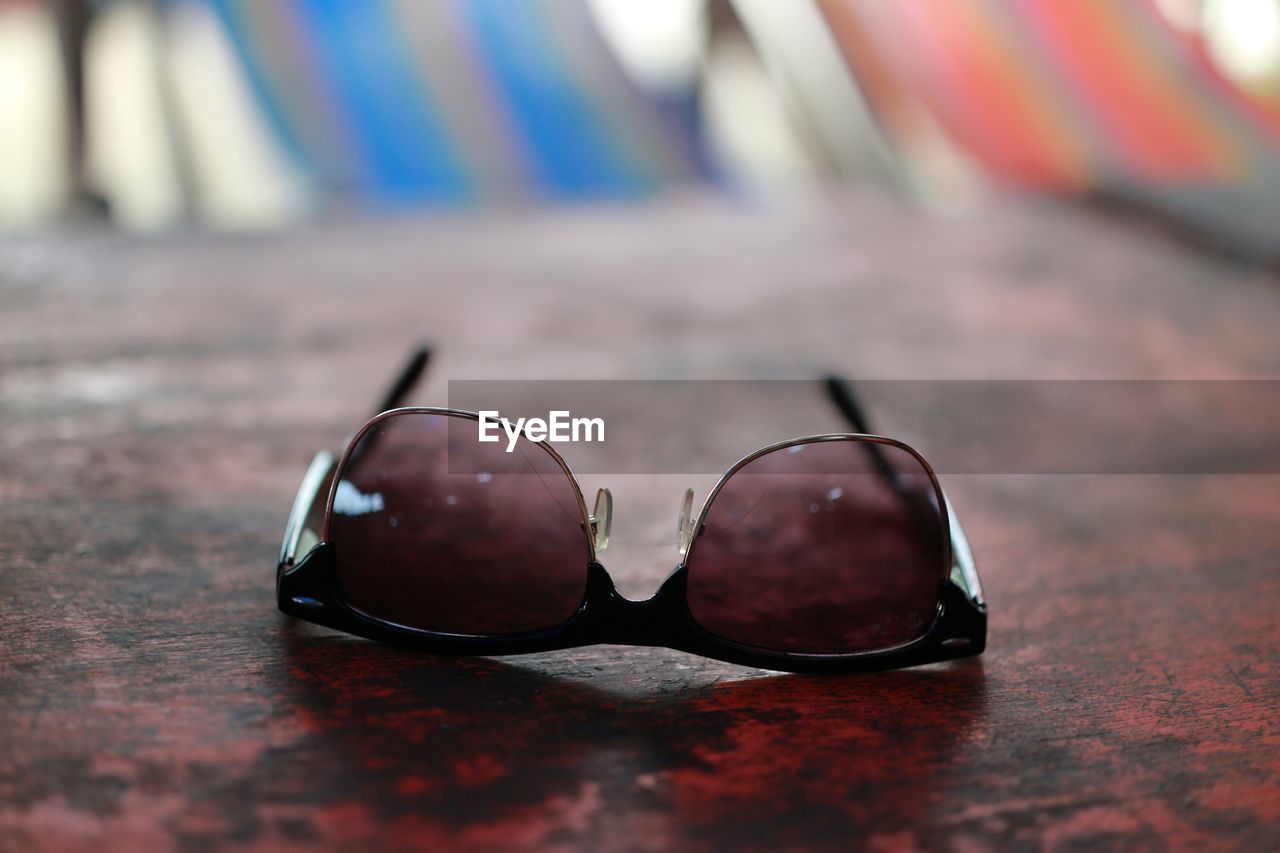 Close-up of sunglasses on table