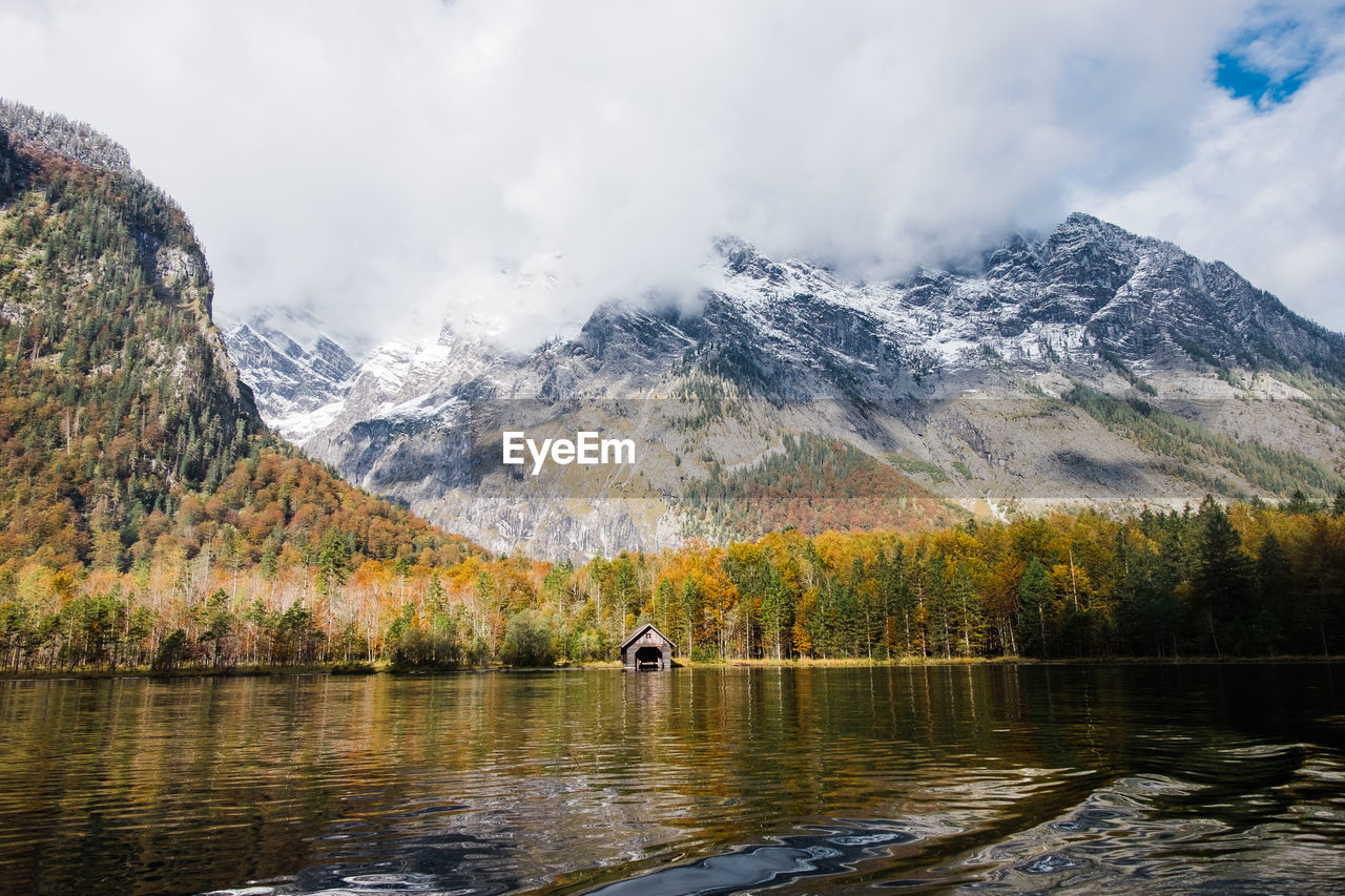 Scenic view of lake königssee in fall with mountains against sky