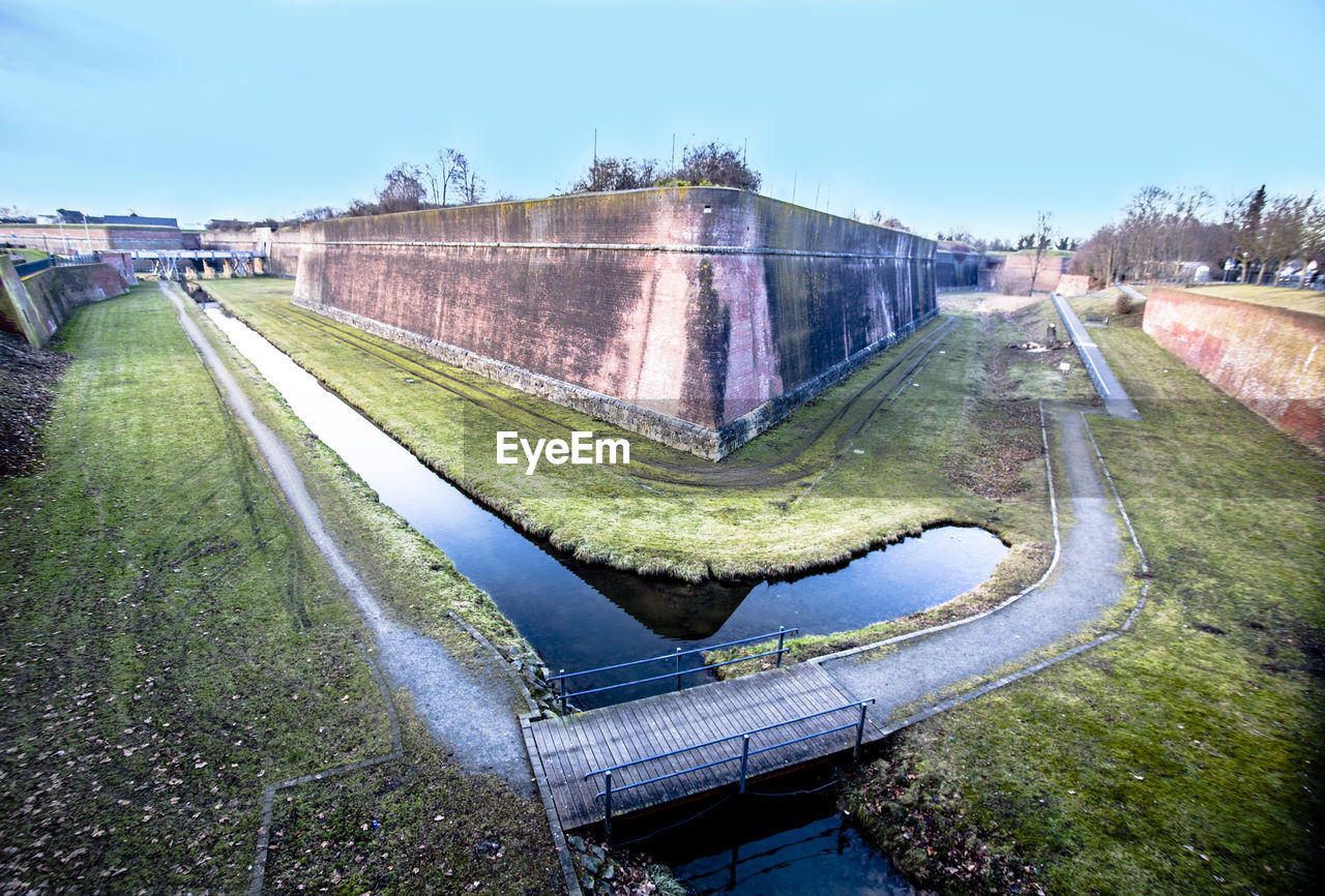 High angle view of canal against clear sky