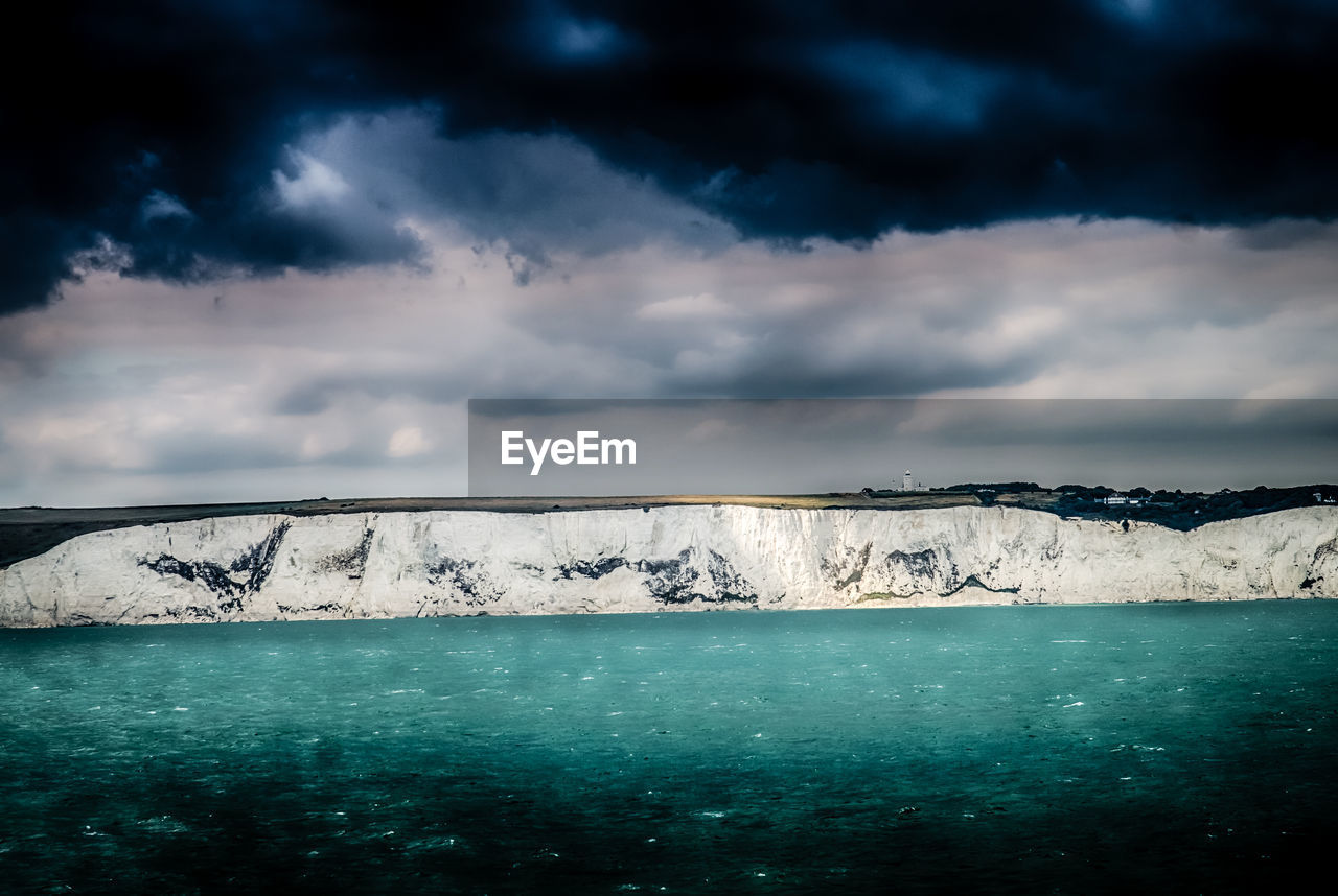 Scenic view of sea against sky during winter