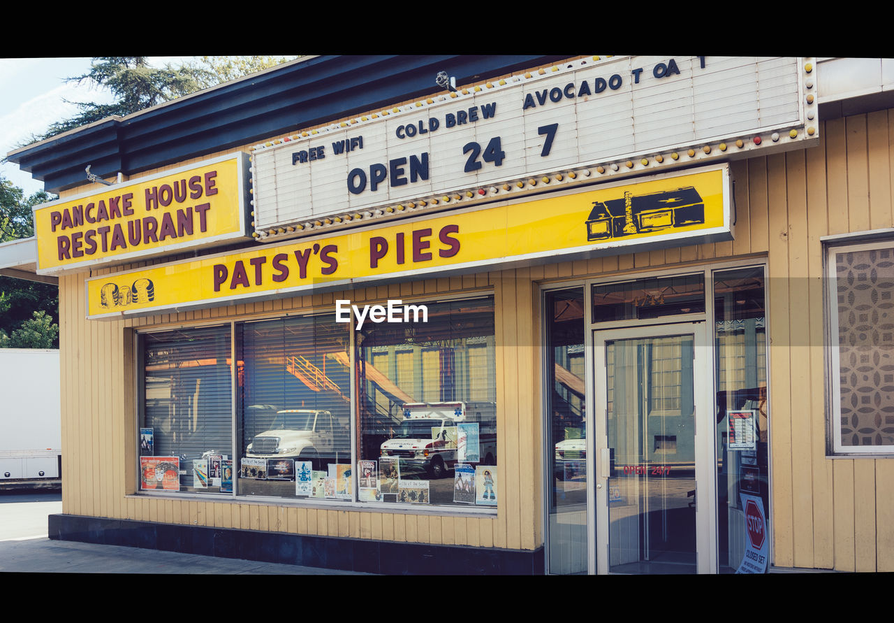 INFORMATION SIGN ON RESTAURANT BY WINDOW