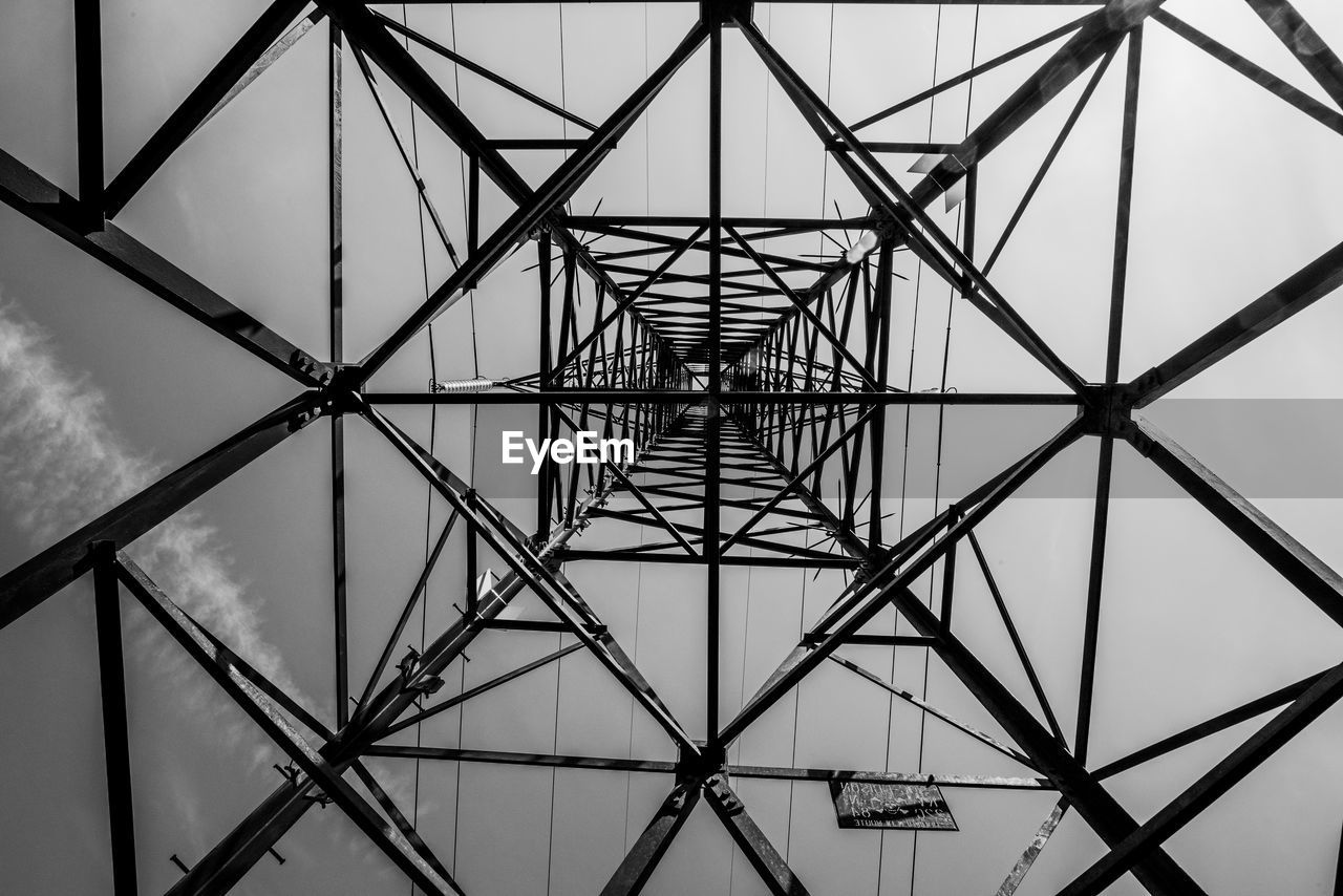 Steel beams make up the intricate geometries of a high voltage pylon