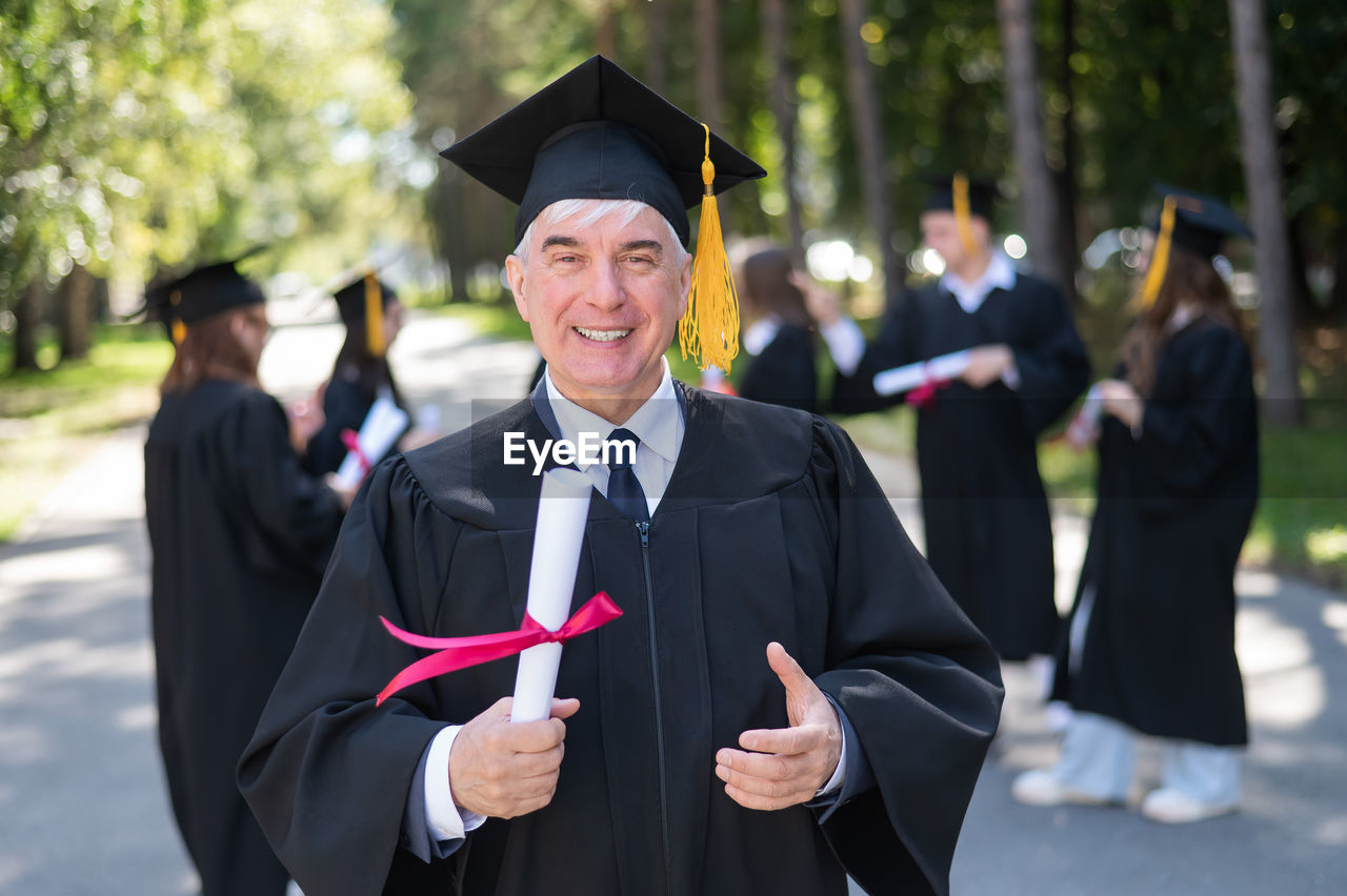 rear view of woman wearing graduation gown