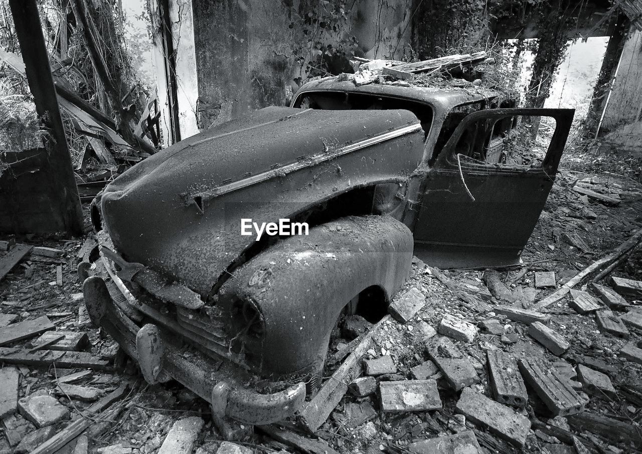 ABANDONED CAR ON RUSTY METAL