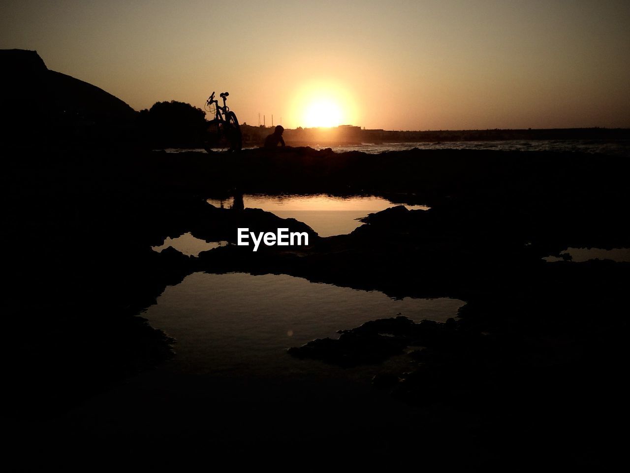 Scenic view of silhouette landscape against sky during sunset