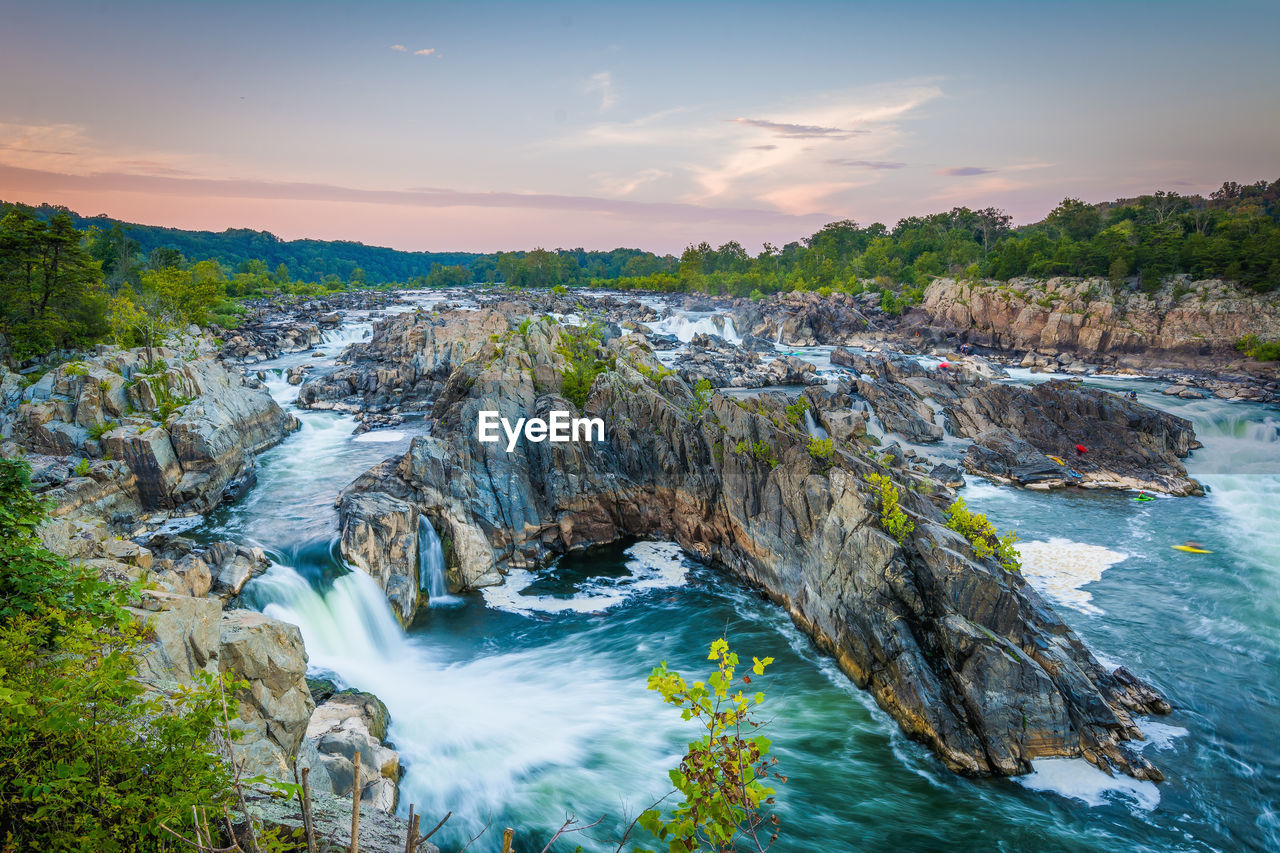 SCENIC VIEW OF ROCKS IN SEA AGAINST SKY