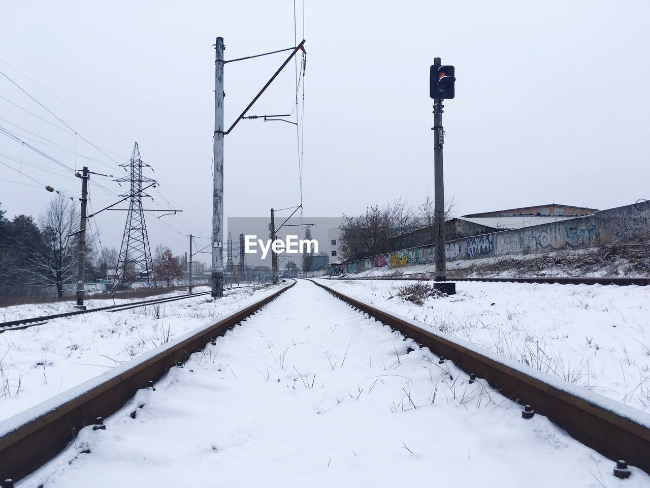 SNOW ON ROAD AGAINST SKY