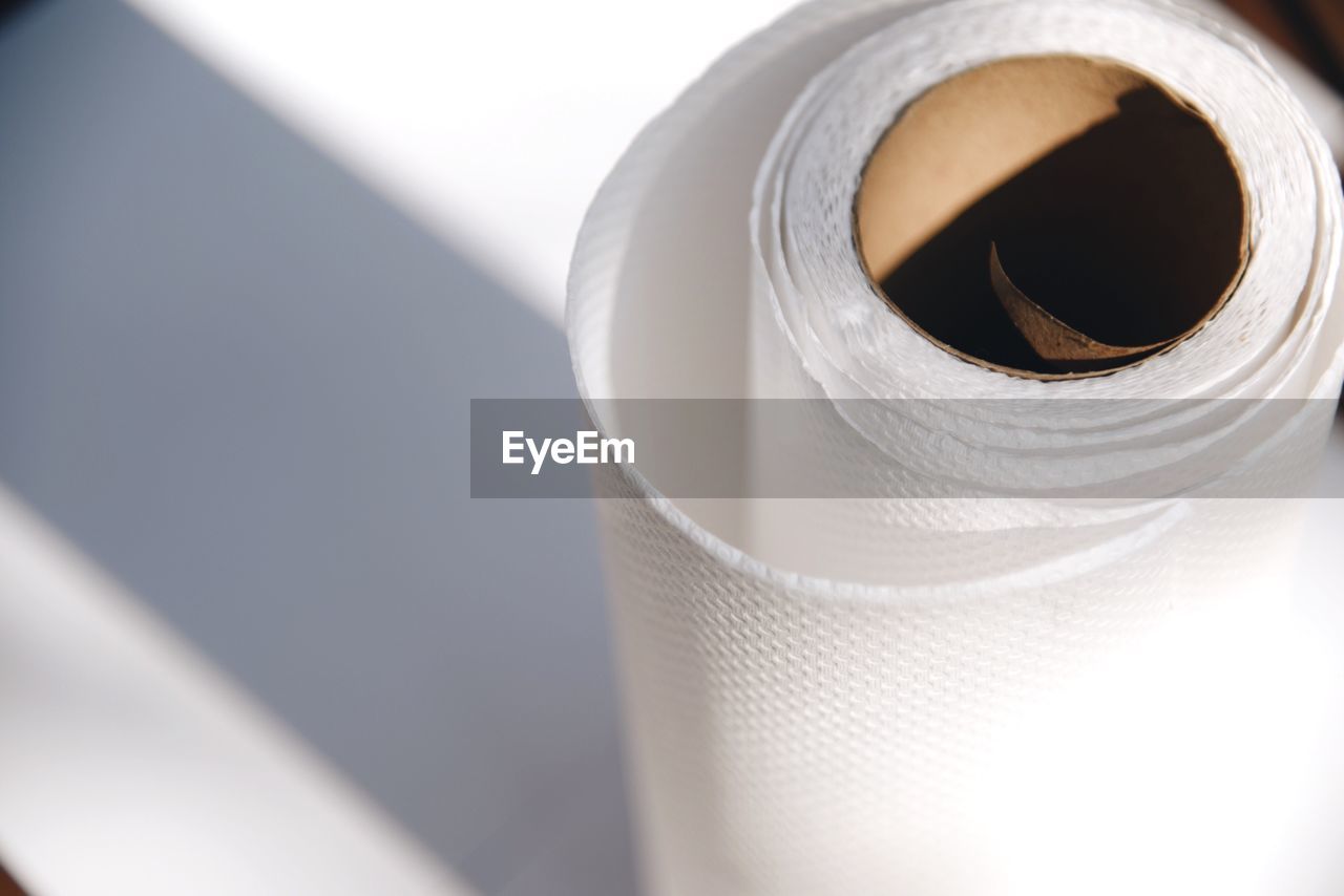 High angle view of rolled up papers on table