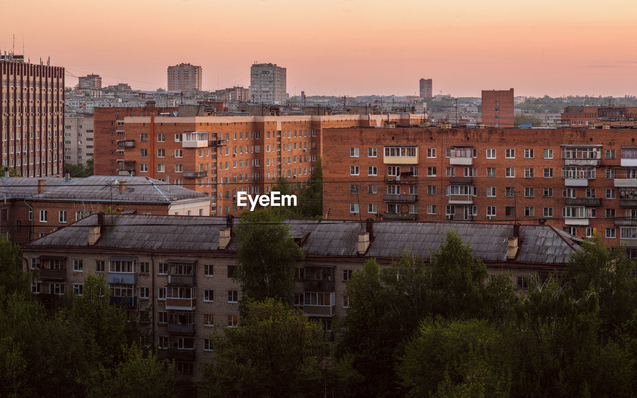 Russian province brick houses cityscape at evening