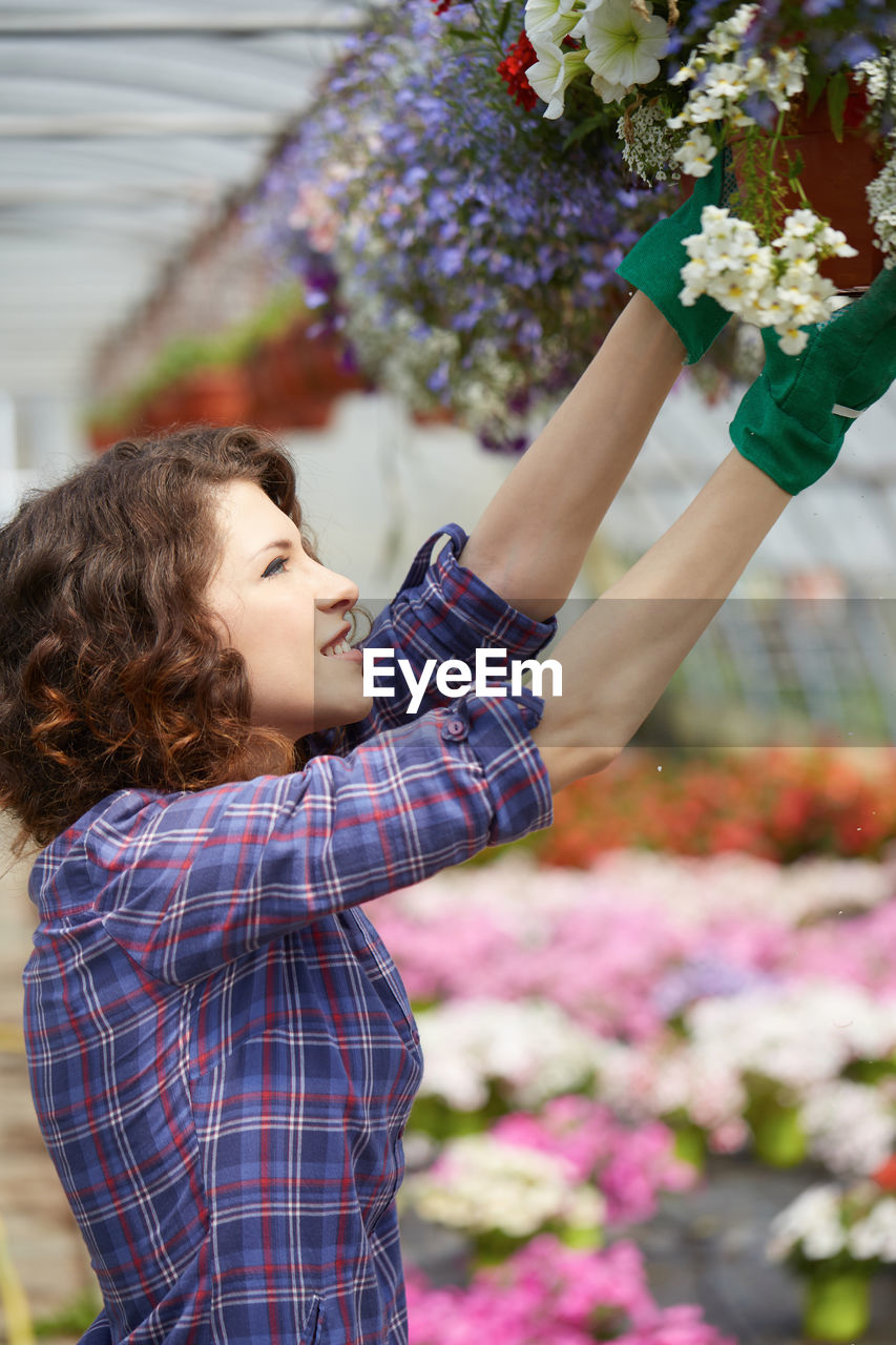 Woman working in greenhouse