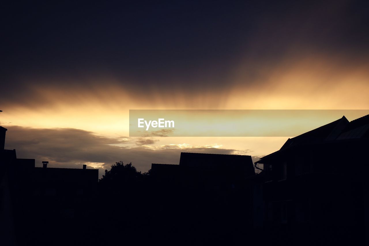 SILHOUETTE CITY AGAINST SKY DURING SUNSET