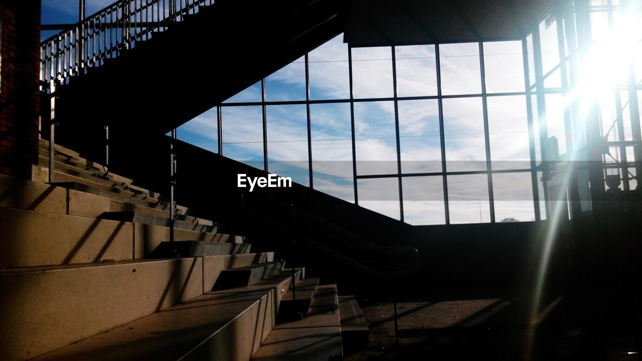 Sunlight streaming through glass at railroad station