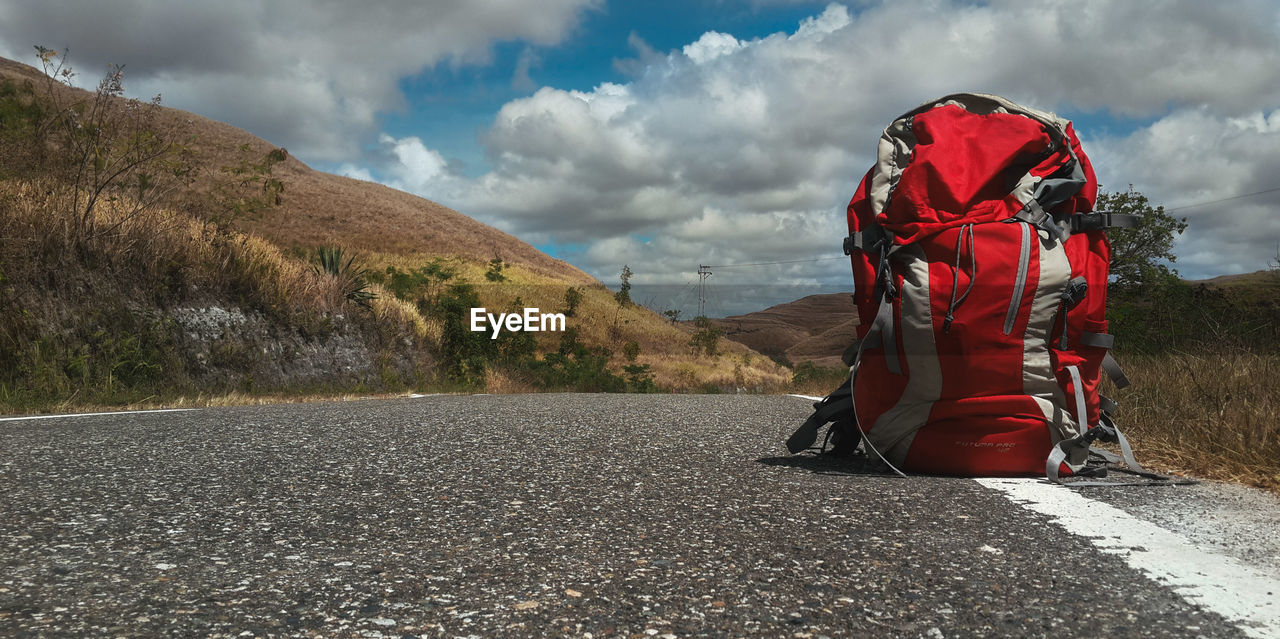 Red backpack is on its journey in sumba