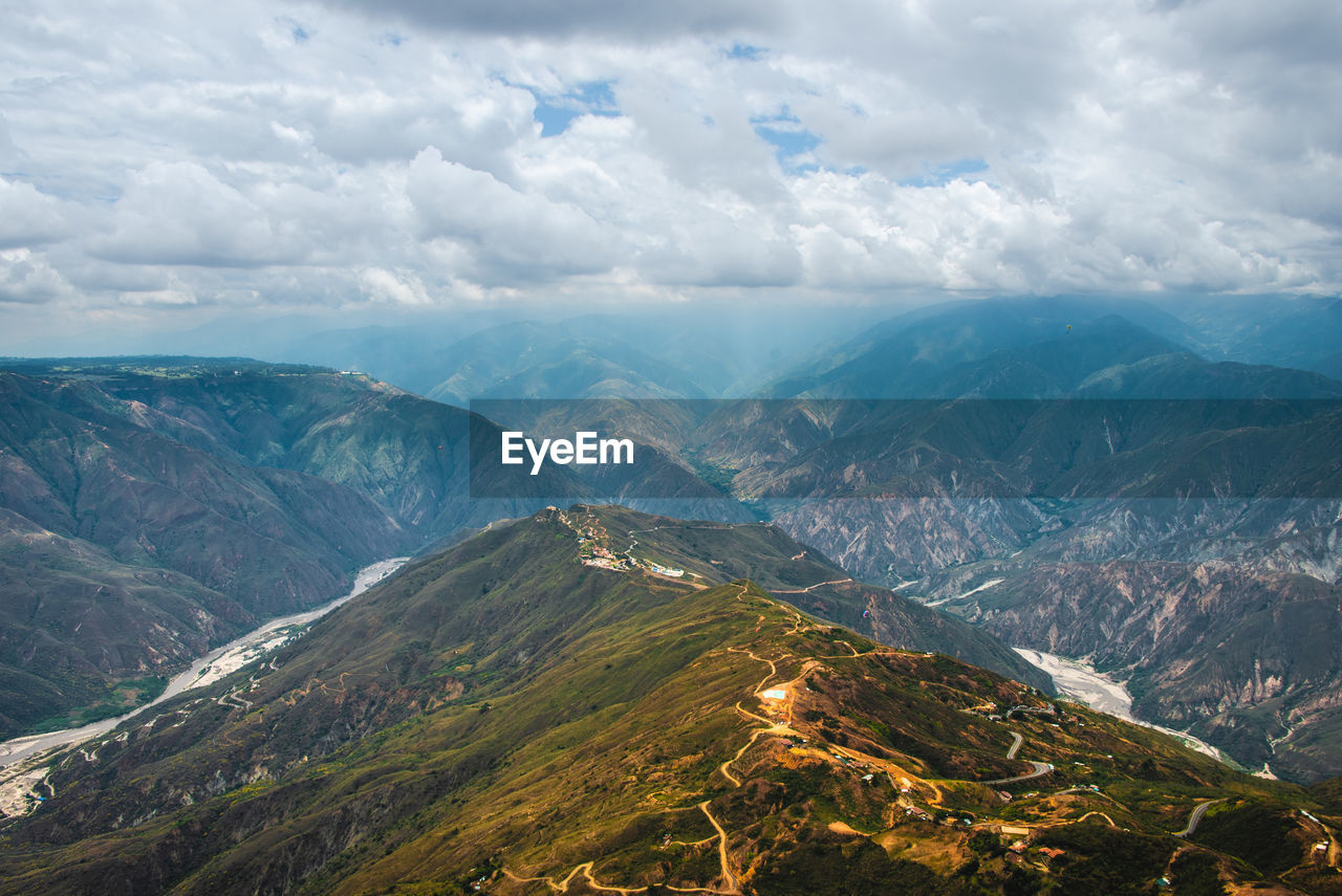 Aerial view of mountains against sky