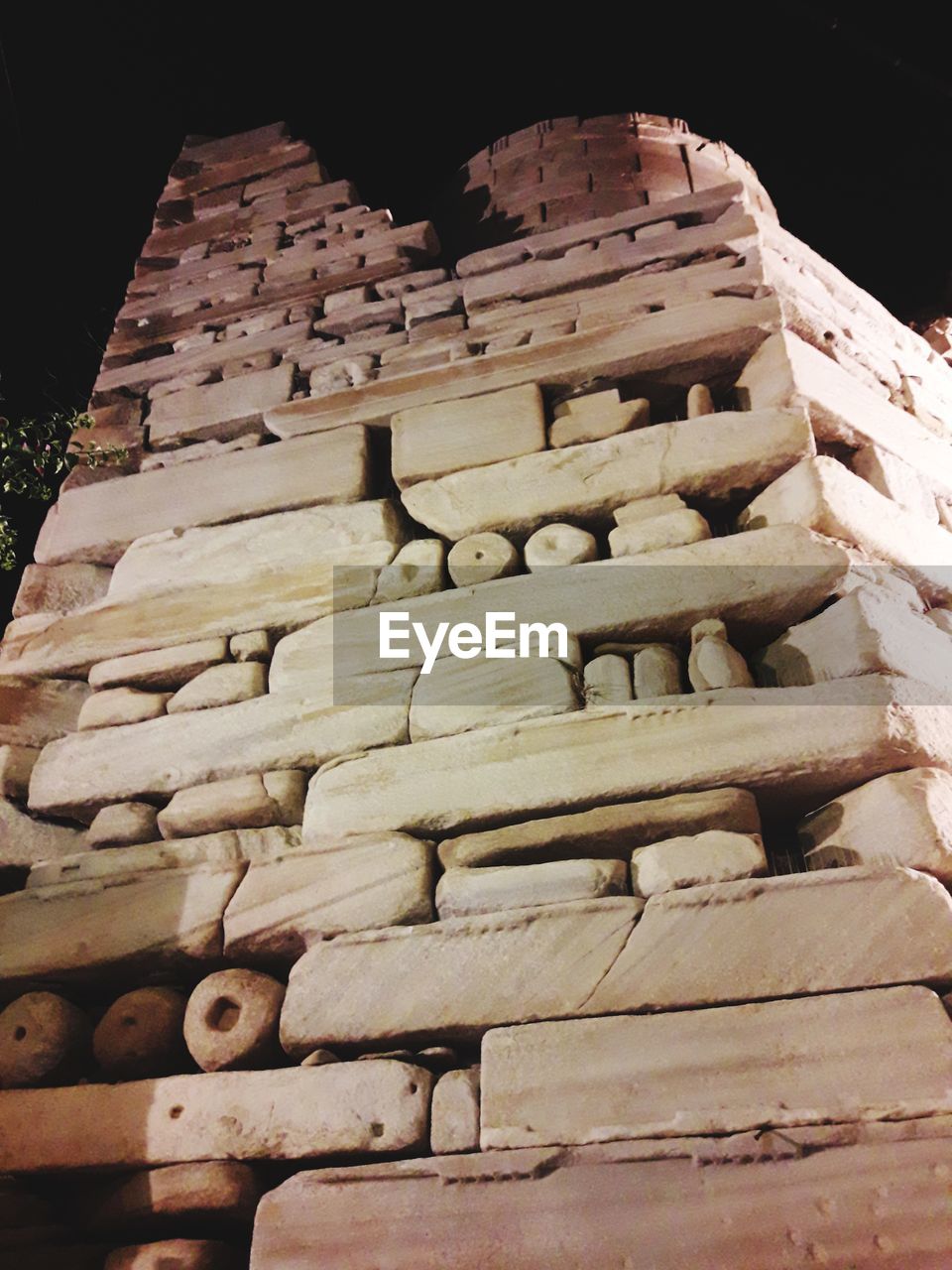 LOW ANGLE VIEW OF STACK OF STONE WALL