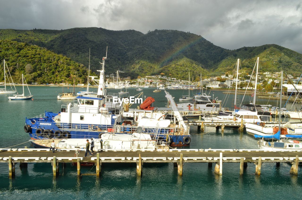 BOATS MOORED IN HARBOR