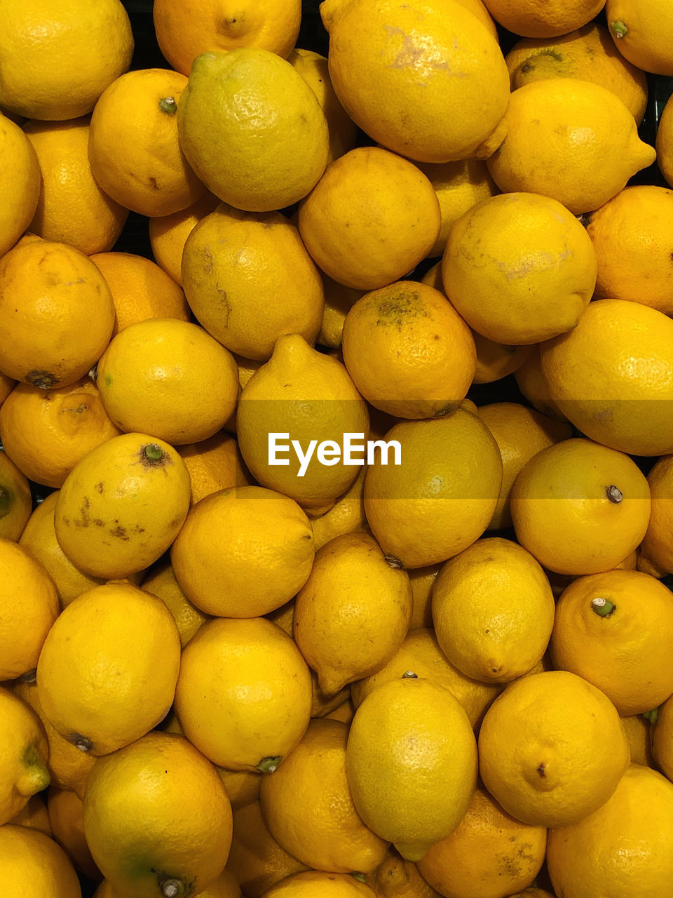 Full frame shot of lemons in market