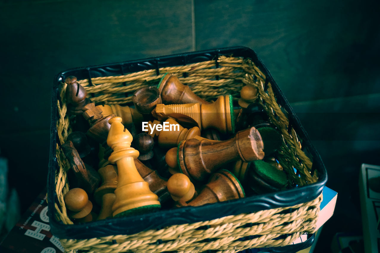 Close-up of chess pieces in basket 