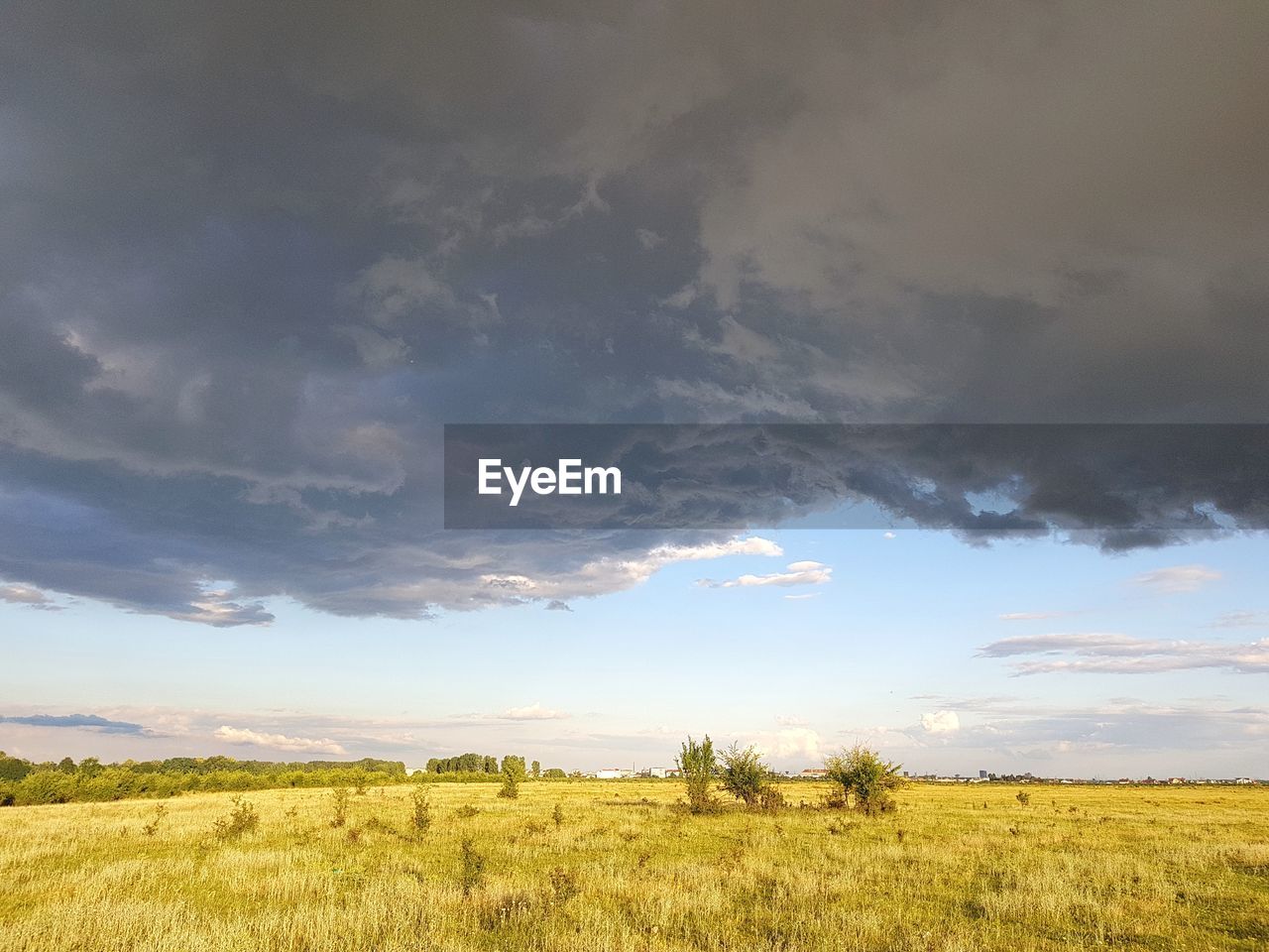 SCENIC VIEW OF LAND AGAINST SKY DURING SUNSET