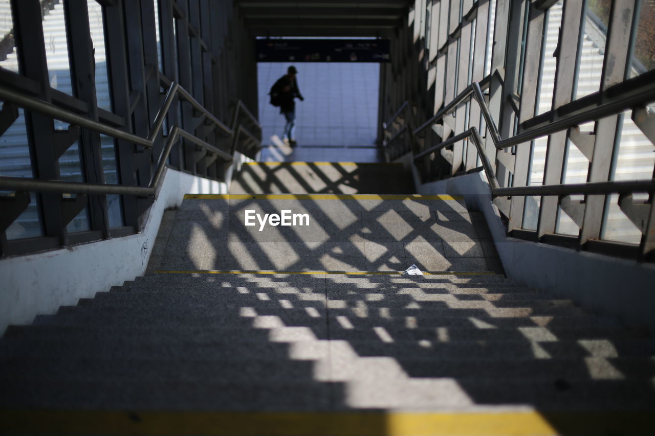 High angle view of shadow falling on staircase