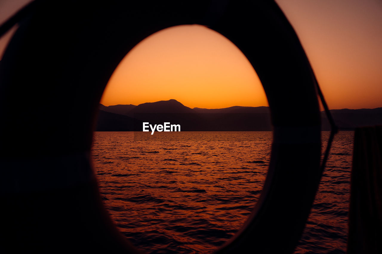 SCENIC VIEW OF SEA DURING SUNSET