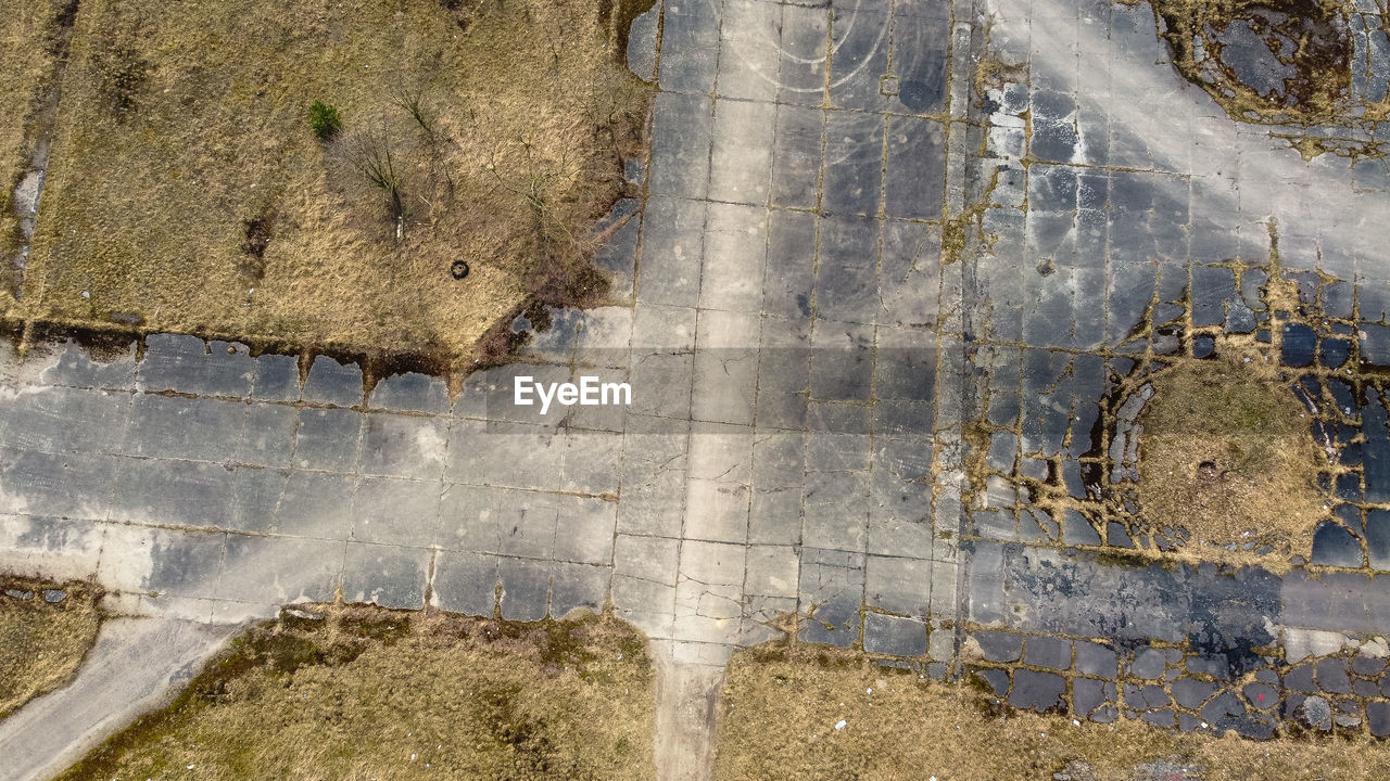 High angle view of abandoned puddle on road